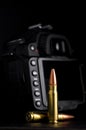 Digital Camera with Large Caliber Bullets Royalty Free Stock Photo