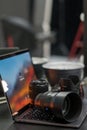 Digital camera, lens and laptop. concept of photographer work station Royalty Free Stock Photo