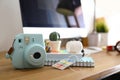 Digital camera and notebooks on table. Modern designer`s workplace Royalty Free Stock Photo