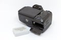 Digital camera with open battery compartment. Royalty Free Stock Photo