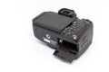 Digital camera with open battery compartment. Royalty Free Stock Photo