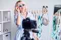 Female vlogger making video about fashion accessories for the internet