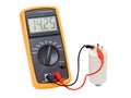 Digital capacitance meter testing one white capacitor Royalty Free Stock Photo