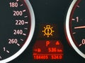 Digital car odometer in dashboard. Used vehicle with mileage meter. Numbers in kilometers