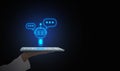 Digital chatbot, conversational agents, robot application, conversation assistant that mimic human speech. Hand holding a tablet