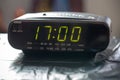 Digital clock closeup displaying 17:00 o`clock.