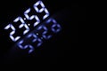 Digital Clock Display Showing 23:59 with Blue LED Glow and Reflection Royalty Free Stock Photo