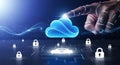 Digital cloud computing security concept with finger touching a glowing blue cloud and padlocks Royalty Free Stock Photo