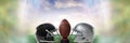 American football versus team helmets with ball with sky transition Royalty Free Stock Photo