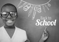 Back to School text and stationery on blackboard with boy Royalty Free Stock Photo