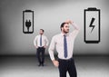 Battery or plug socket with Businessman looking in opposite directions