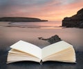 Digital composite of Beautiful sunrise landsdcape of idyllic Broadhaven Bay beach on Pembrokeshire Coast in Wales in pages of open