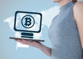 Bitcoin computer icon and woman with tablet