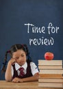 Bored student girl at table against blue blackboard with time for review text