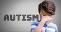 Boy against grey background with autism text Royalty Free Stock Photo