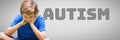 Boy against grey background with autism text Royalty Free Stock Photo