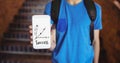 Boy holding a phone with school icons on screen Royalty Free Stock Photo