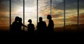 Business people at a meeting silhouettes against building Royalty Free Stock Photo