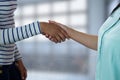 Business people shaking hands against blurred background Royalty Free Stock Photo