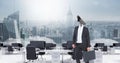 Businessman with CCTV head in office above city skyline Royalty Free Stock Photo