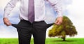 Businessman with empty pockets in nature Royalty Free Stock Photo