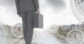 Businessman holding briefcase with surreal clocks time transition