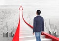 businessman walking on red arrow stairs with graphs Royalty Free Stock Photo