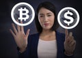 Businesswoman touching bitcoin graphic icon and dollar icon Royalty Free Stock Photo
