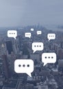 Chat bubble icons over city Royalty Free Stock Photo