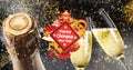 Digital composite of chinese new year text amidst champagne bottle and flutes against fireworks
