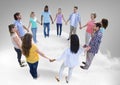 Circle of people holding hands together on clouds Royalty Free Stock Photo