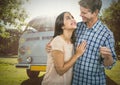 Couple Holding key in front of camper van Royalty Free Stock Photo