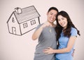 Couple Holding key with house drawing in front of vignette Royalty Free Stock Photo