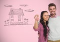 Couple Holding key with house drawing in front of vignette Royalty Free Stock Photo