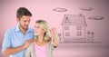 Couple Holding key house home drawing in front of vignette Royalty Free Stock Photo