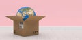 Composite 3d image of digital composite image of globe in brown cardboard box Royalty Free Stock Photo