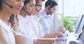 Diverse call center reps work with futuristic interface in 4k digital composite Royalty Free Stock Photo