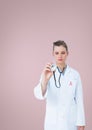 Doctor woman with breast cancer awareness ribbon Royalty Free Stock Photo