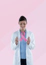 Doctor woman with breast cancer awareness ribbon Royalty Free Stock Photo