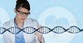 Doctor woman interacting with 3D DNA strand Royalty Free Stock Photo