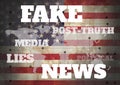 Fake news and associated text over world map and USA flag Royalty Free Stock Photo