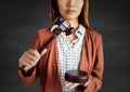 Female judge with gavel against grey wall Royalty Free Stock Photo