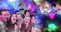 Friends singing karaoke with geometric party lights venue atmosphere Royalty Free Stock Photo