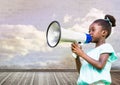 Girl with megaphone in front of cloudy room