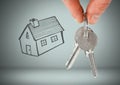 Hand Holding key with house drawing in front of vignette Royalty Free Stock Photo