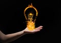 hand with light fire icons over. Black background Royalty Free Stock Photo