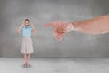 Hand pointing at happy business woman against grey background Royalty Free Stock Photo