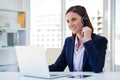 Happy customer care representative woman against office background Royalty Free Stock Photo