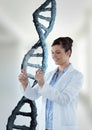 Happy doctor woman holding a glass with 3D DNA strand Royalty Free Stock Photo