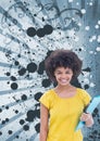 Happy young student woman holding a folder against blue splattered background